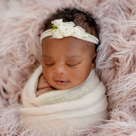 Sleeping,African,Newborn,Baby,Girl,With,Diadem